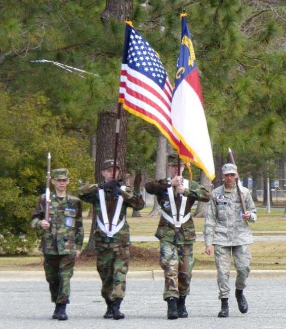 Cadets with US and NC flags at Drill and Ceremonies Academy